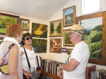 Raymond J. Seiner and visitors to his studio