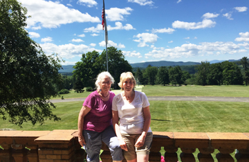 Cornelia Seckel and Heidi Robertson on the Rose Terrace overlooking part of the golf course at Cranwell