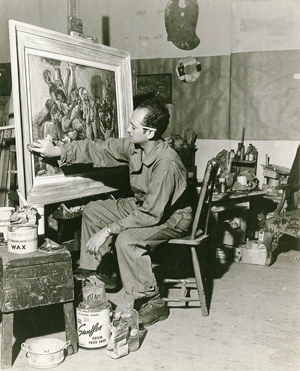 Ben Wilson at work on “The Muckrakers” in his Chelsea studio in 1944