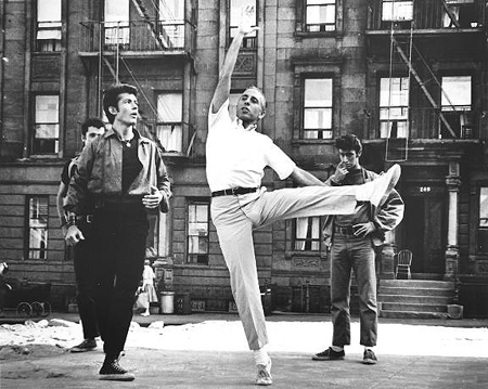 Jerome Robbins (center) demonstrating a dance combination for George Chakiris (left) for the movie version of West Side Story. 